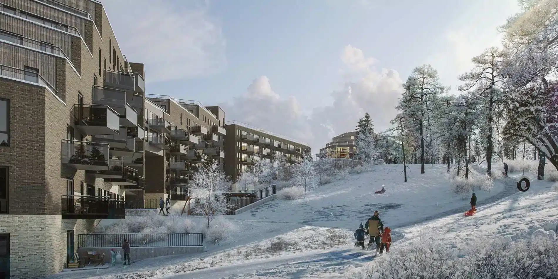 Moderne boligblokker grenser til en snødekt bakke der folk aker og går blant trærne en vinterdag.