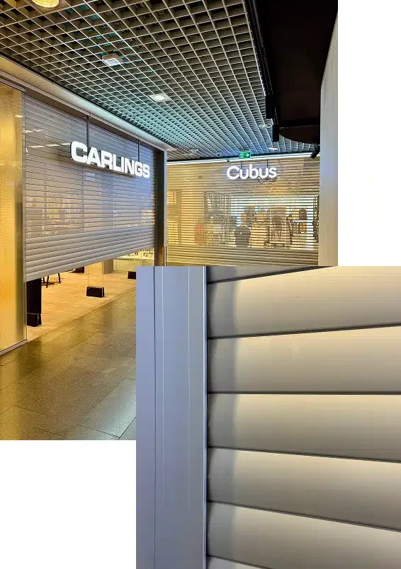 Utsikt over et kjøpesenter med Carlings- og Cubus-butikker stengt bak metallskodder. I forgrunnen ses et nærbilde av skoddens horisontale lameller.